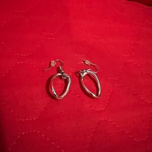 Women’s silver pierced earrings.